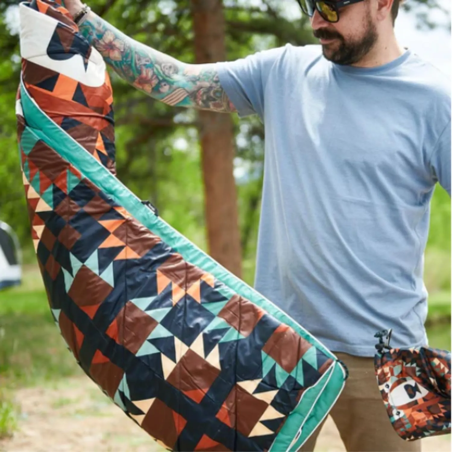 Rumpl Original Puffy Blanket - Warm Puffy Camping Blanket, 100% Recycled Polyester Insulation, Lightweight, Packable, Water-Resistant, Outdoor Puffer Blanket, 52"x75", V1, Grizzly Slumber