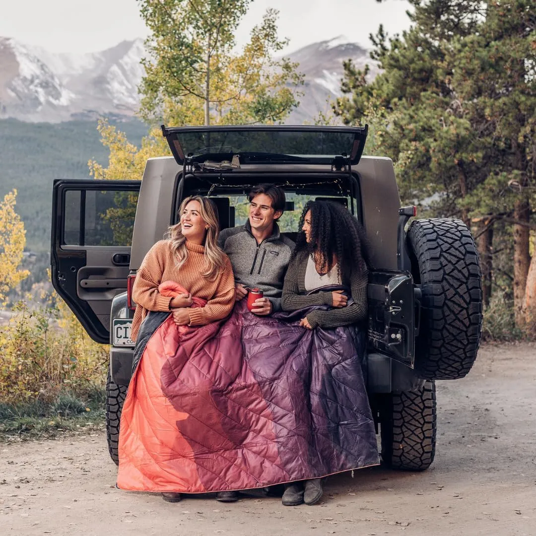 Rumpl Original Puffy Blanket - Warm Puffy Camping Blanket, 100% Recycled Polyester Insulation, Lightweight, Packable, Water-Resistant, Outdoor Puffer Blanket, 52"x75", V1, Sunset Fade